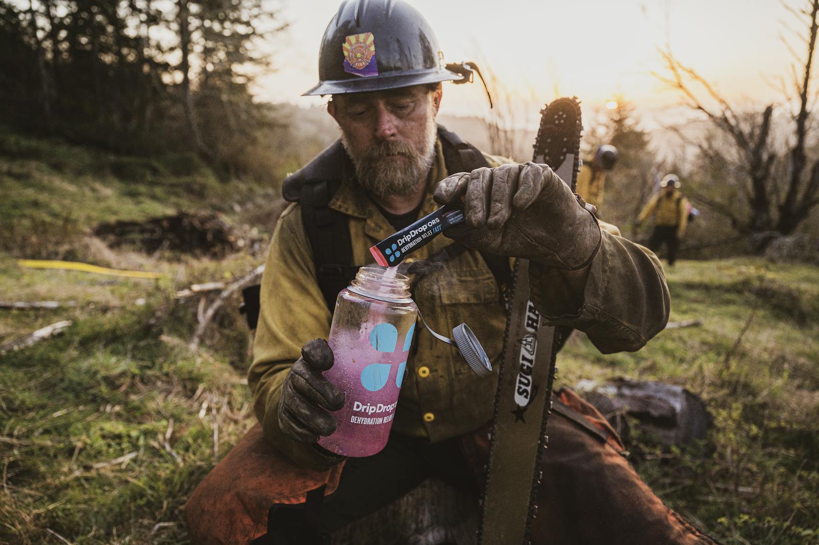 Drip Drop vs Liquid IV: Working man pouring ORS in tumbler