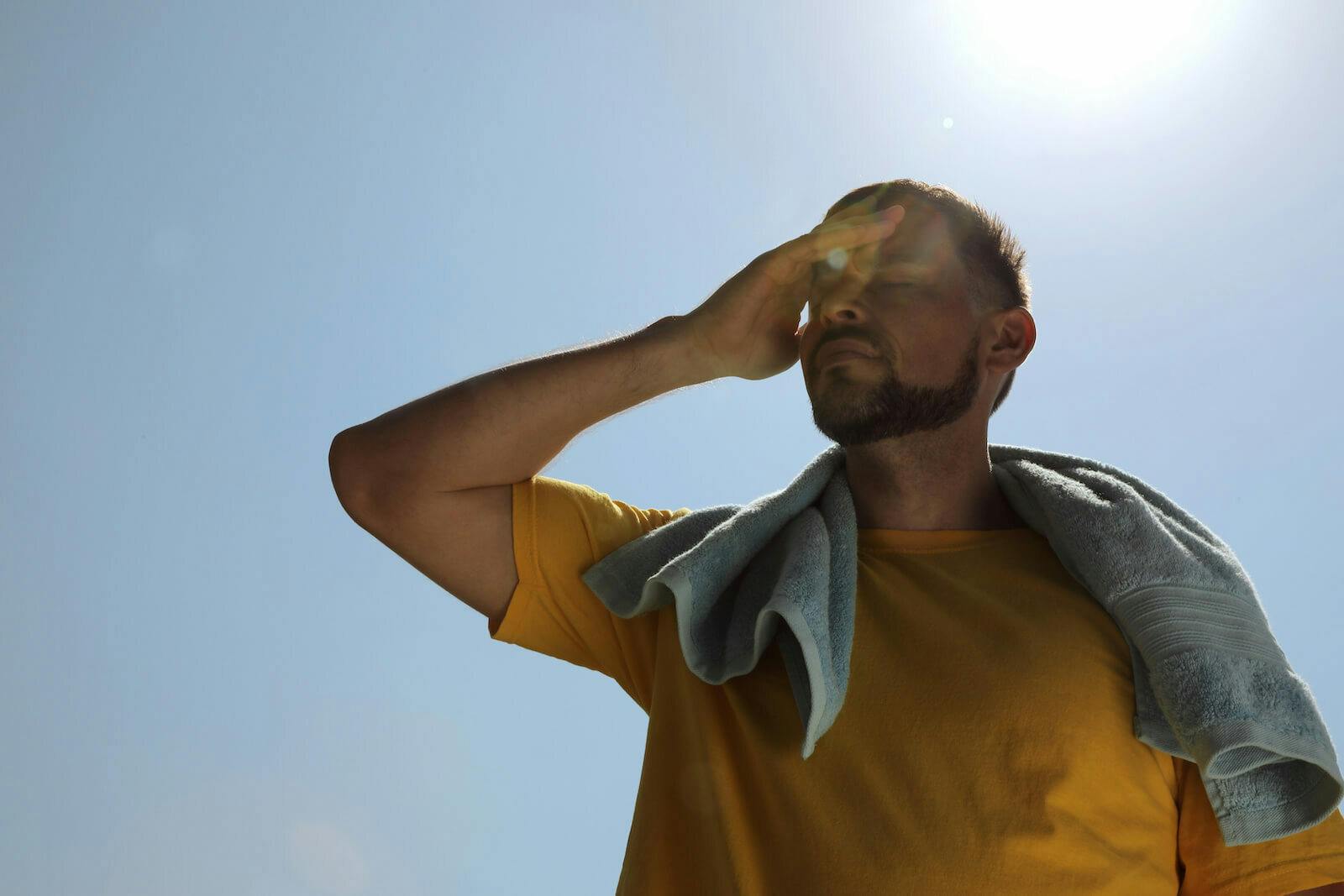 How to cool down: Man suffering from heat stroke outdoors